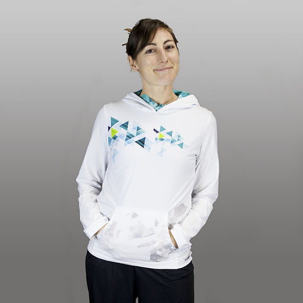 woman wearing a white hoodie hands in pocket