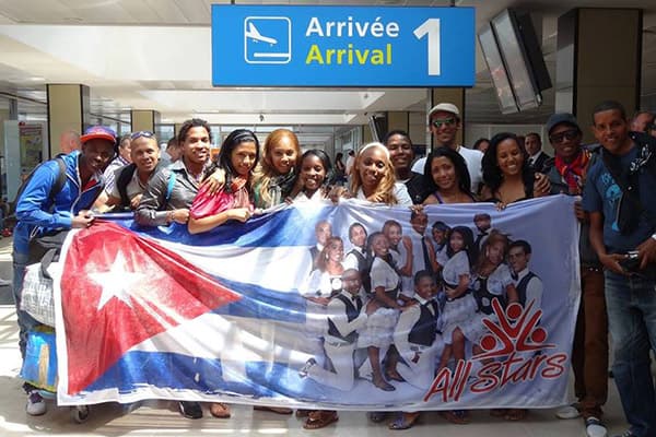 group holding banner with portorican flag
