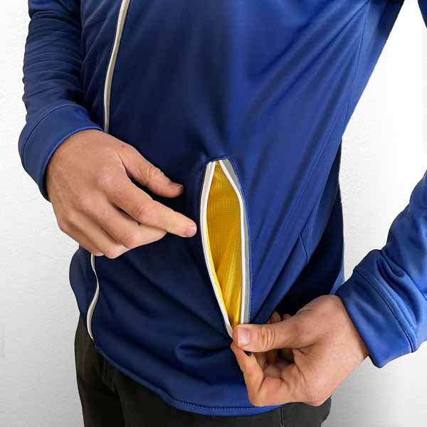 hand in pocket of a black and maroon sport jacket