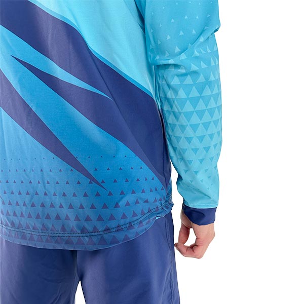 back of a person wearing a sublimated turquoise jacket