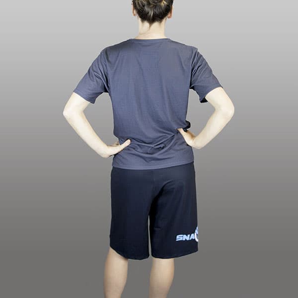 back of woman wearing long black shorts and dark grey tshirt