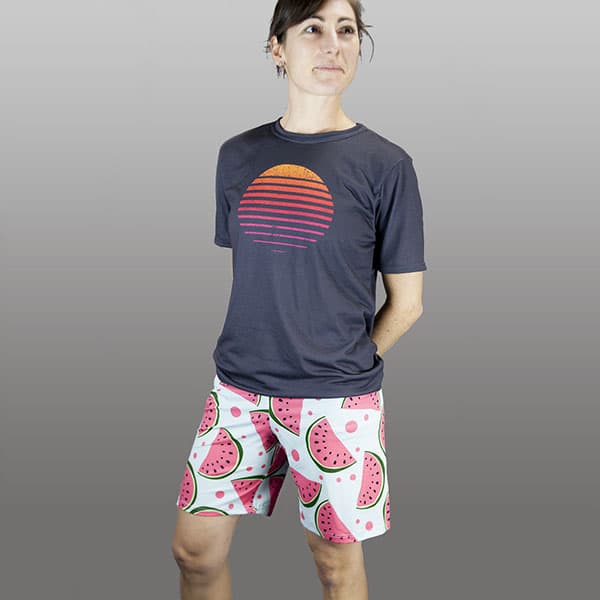 woman smiling wearing watermelon shorts and dark grey tshirt